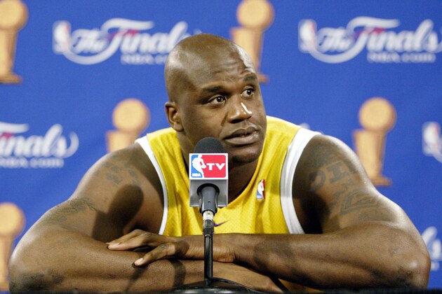 AUBURN HILLS, UNITED STATES:  Shaquille O'Neal of the Los Angeles Lakers answers question before practice for game five of the NBA Finals against the Detroit Pistons 14 June 2004 at The Palace in Auburn Hills, MI. The Pistons lead the best-of-seven game series 3-1.      AFP PHOTO/Jeff HAYNES  (Photo credit should read JEFF HAYNES/AFP via Getty Images)