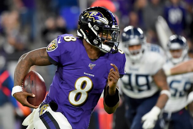 BALTIMORE, MARYLAND - JANUARY 11: Lamar Jackson #8 of the Baltimore Ravens runs against the Tennessee Titans during the AFC Divisional Playoff game at M&T Bank Stadium on January 11, 2020 in Baltimore, Maryland. (Photo by Will Newton/Getty Images)