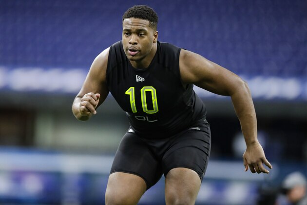 Charlotte offensive lineman Cameron Clark runs a drill at the NFL football scouting combine in Indianapolis, Friday, Feb. 28, 2020. (AP Photo/Michael Conroy)