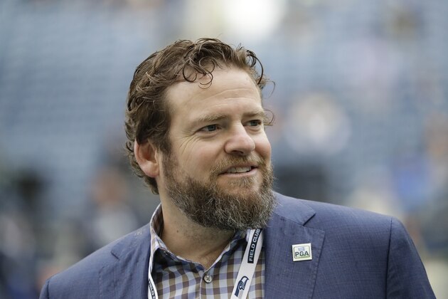 Seattle Seahawks general manager John Schneider walks on the field during warmups before an NFL football game against the Los Angeles Rams, Thursday, Oct. 3, 2019, in Seattle. (AP Photo/Elaine Thompson)