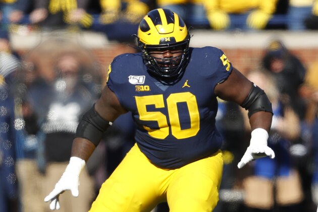 Michigan offensive lineman Michael Onwenu (50) plays against Michigan State in the first half of an NCAA college football game in Ann Arbor, Mich., Saturday, Nov. 16, 2019. (AP Photo/Paul Sancya)