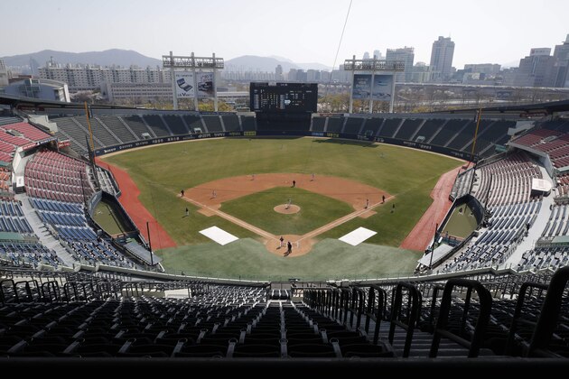 Stadium seats are empty as a part of precaution against the new coronavirus during the LG Twins baseball team's intrasquad game in Seoul, South Korea, Sunday, April 5, 2020. The intrasquad game is aired live through the team's YouTube channel for its fans. The Korea Baseball Organization has postponed the start of new season to prevent the spread of the new coronavirus. (AP Photo/Lee Jin-man) Stadium seats are empty as a part of precaution against the new coronavirus during the LG Twins baseball team's intrasquad game in Seoul, South Korea, Sunday, April 5, 2020. The intrasquad game is aired live through the team's YouTube channel for its fans. The Korea Baseball Organization has postponed the start of new season to prevent the spread of the new coronavirus. (AP Photo/Lee Jin-man)