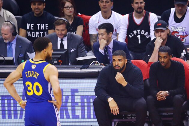 TORONTO, ONTARIO - JUNE 02:  Drake looks on in the first half during Game Two of the 2019 NBA Finals between the Golden State Warriors and the Toronto Raptors at Scotiabank Arena on June 02, 2019 in Toronto, Canada.  NOTE TO USER: User expressly acknowledges and agrees that, by downloading and or using this photograph, User is consenting to the terms and conditions of the Getty Images License Agreement. (Photo by Vaughn Ridley/Getty Images)