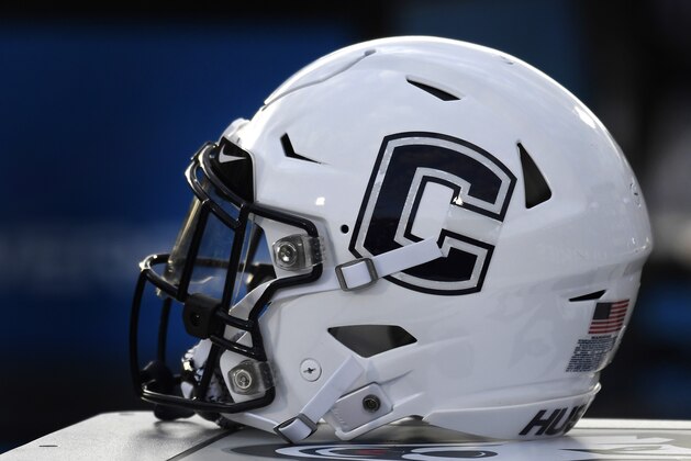 A Connecticut football helmet is seen on the sideline during an NCAA college football game, Saturday, Sept. 7, 2019, in East Hartford, Conn. (AP Photo/Jessica Hill)