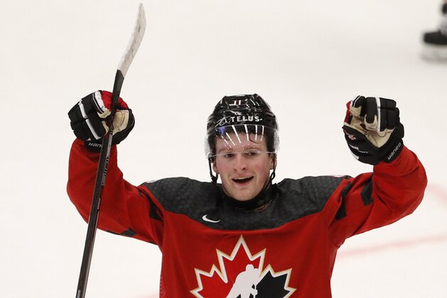 Canada's Alexis Lafreniere celebrates his sides first goal during the U20 Ice Hockey Worlds match between Canada and the United States in Ostrava, Czech Republic, Thursday, Dec. 26, 2019. (AP Photo/Petr David Josek)