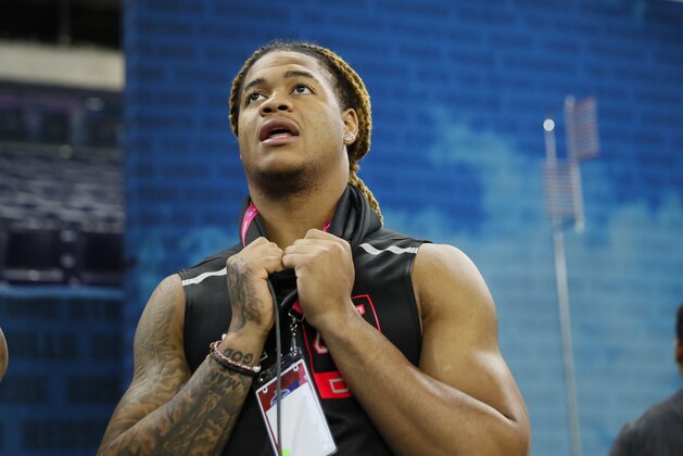 Ohio State defensive lineman Chase Young watches a drill at the NFL football scouting combine in Indianapolis, Saturday, Feb. 29, 2020. (AP Photo/Charlie Neibergall)