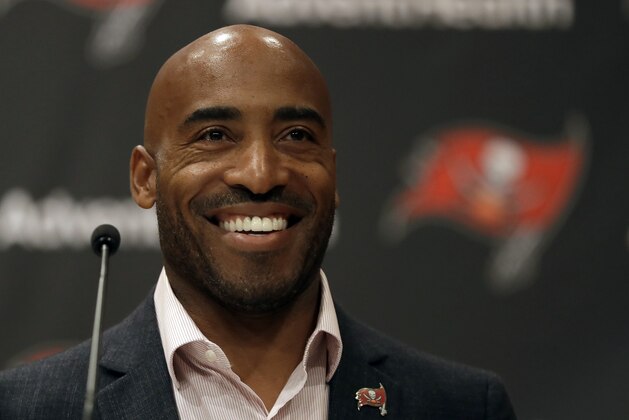 Former Tampa Bay Buccaneers cornerback Ronde Barber smiles during a Buccaneers NFL football Ring of Honor news conference Tuesday, Aug. 13, 2019, in Tampa, Fla. Barber will be inducted during halftime of the Bucs game on Sept. 22nd. (AP Photo/Chris O'Meara)