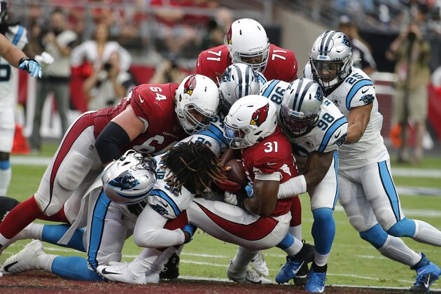 FILE - In this Sunday, Sept. 22, 2019, file photo, Arizona Cardinals' David Johnson (31) is stopped by the Carolina Panthers defense during an NFL football game in Glendale, Ariz.  You can take that