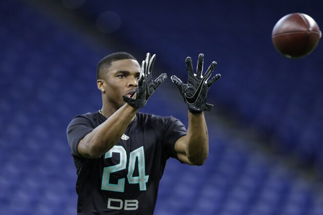 Ohio State defensive back Jeff Okudah runs a drill at the NFL football scouting combine in Indianapolis, Sunday, March 1, 2020. (AP Photo/Michael Conroy)