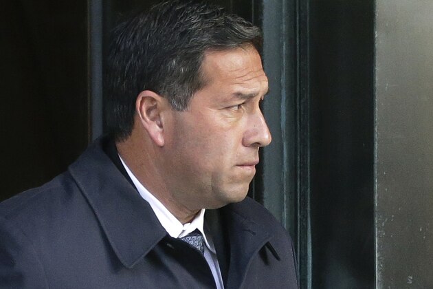 FILE - In this March 25, 2019 file photo Jorge Salcedo, former University of California at Los Angeles men's soccer coach, departs federal court in Boston, after facing charges in a nationwide college admissions bribery scandal. Salcedo will plead guilty to taking bribes as part of the college admissions cheating scheme, federal prosecutors said Tuesday, April 21, 2020. The former UCLA coach is to admit to getting bribes in exchange for helping get one male and one female student into the school as fake soccer recruits. (AP Photo/Steven Senne, File)