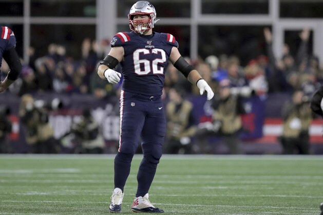 New England Patriots guard Joe Thuney waits to congratulate quarterback Tom Brady on his touchdown pass in the second half of an NFL football game against the New York Giants, Thursday, Oct. 10, 2019, in Foxborough, Mass. (AP Photo/Charles Krupa)