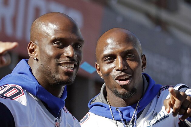 FILE - In this Feb. 5, 2019, file photo, New England Patriots Jason, left, and Devin McCourty react to fans during their Super Bowl victory parade in Boston. The Patriotsโ twin combination in the secondary will remain intact for another season. A person familiar with the move says cornerback Jason McCourty has agreed to a two-year deal to remain with the Super Bowl champions. The person spoke on the condition of anonymity to The Associated Press because teams are not permitted to announce any moves until later in the day. (AP Photo/Elise Amendola, File) FILE - In this Feb. 5, 2019, file photo, New England Patriots Jason, left, and Devin McCourty react to fans during their Super Bowl victory parade in Boston. The Patriotsโ twin combination in the secondary will remain intact for another season. A person familiar with the move says cornerback Jason McCourty has agreed to a two-year deal to remain with the Super Bowl champions. The person spoke on the condition of anonymity to The Associated Press because teams are not permitted to announce any moves until later in the day. (AP Photo/Elise Amendola, File)