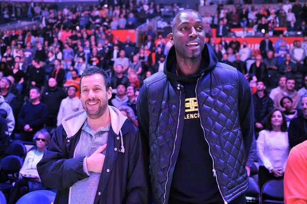 LOS ANGELES, CALIFORNIA - DECEMBER 17: Adam Sandler (L) and Kevin Garnett stand for the national anthem prior to a basketball game between the Los Angeles Clippers and the Phoenix Suns at Staples Center on December 17, 2019 in Los Angeles, California. (Photo by Allen Berezovsky/Getty Images)
