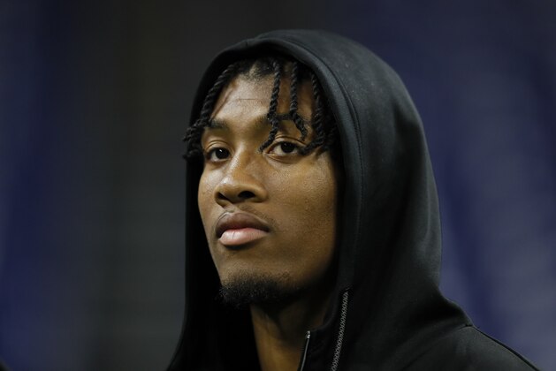 Clemson linebacker Isaiah Simmons watches the 40-yard dash at the NFL football scouting combine in Indianapolis, Saturday, Feb. 29, 2020. (AP Photo/Charlie Neibergall)