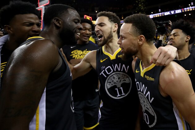 OAKLAND, CALIFORNIA - MAY 16: Stephen Curry #30, Klay Thompson #11 and Draymond Green #23 of the Golden State Warriors celebrate after defeating the Portland Trail Blazers 114-111 in game two of the NBA Western Conference Finals at ORACLE Arena on May 16, 2019 in Oakland, California. NOTE TO USER: User expressly acknowledges and agrees that, by downloading and or using this photograph, User is consenting to the terms and conditions of the Getty Images License Agreement. (Photo by Ezra Shaw/Getty Images)