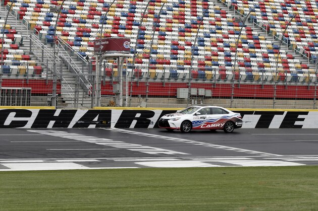 Driver Matt Kenseth drives soldiers from Ft. Bragg around the track in a pace car after a news conference about pre race activities for the upcoming NASCAR Cup series Coca-Cola 600 auto race at Charlotte Motor Speedway in Concord, N.C., Thursday, May 11, 2017. The pre race show on May 28, 2017 features a salute to the military. (AP Photo/Chuck Burton)