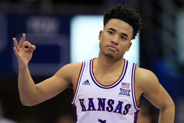 FILE - In this March 4, 2020, file photo, Kansas guard Devon Dotson celebrates a 3-point basket during the second half of the team's NCAA college basketball game against TCU in Lawrence, Kan. Dotson is entering the NBA draft after leading the Big 12 Conference in scoring his sophomore season. “In basketball, this has always been my ultimate dream and my time at KU has prepared me,” Dotson said Monday, April 13, 2020, in a news release.(AP Photo/Orlin Wagner, File) FILE - In this March 4, 2020, file photo, Kansas guard Devon Dotson celebrates a 3-point basket during the second half of the team's NCAA college basketball game against TCU in Lawrence, Kan. Dotson is entering the NBA draft after leading the Big 12 Conference in scoring his sophomore season. “In basketball, this has always been my ultimate dream and my time at KU has prepared me,” Dotson said Monday, April 13, 2020, in a news release.(AP Photo/Orlin Wagner, File)