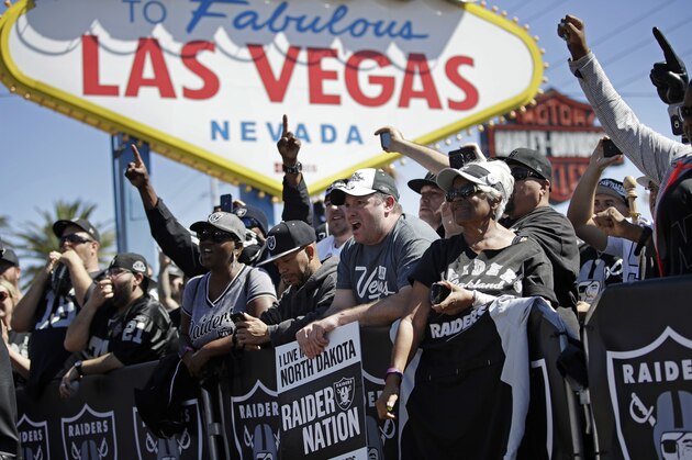 Fans cheer as the Oakland Raiders announce their fourth round draft pick during an NFL football draft event Saturday, April 29, 2017, in Las Vegas. (AP Photo/John Locher)