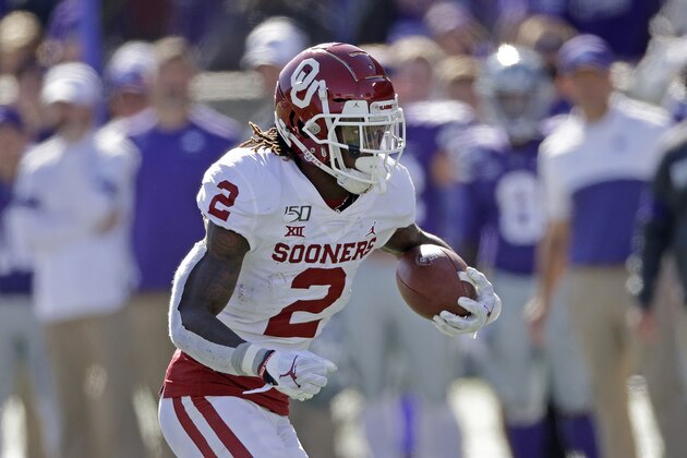Oklahoma wide receiver CeeDee Lamb runs the ball during the second half of an NCAA college football game against Kansas State Saturday, Oct. 26, 2019, in Manhattan, Kan. Kansas State won 48-41. (AP Photo/Charlie Riedel)