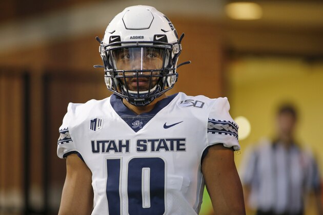 Utah State quarterback Jordan Love walks onto the field before the start of an NCAA college football game against Wake Forest in Winston-Salem, N.C., Friday, Aug. 30, 2019. Wake Forest won 38-35. (AP Photo/Nell Redmond)