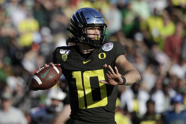 Oregon quarterback Justin Herbert passes against Wisconsin during first half of the Rose Bowl NCAA college football game Wednesday, Jan. 1, 2020, in Pasadena, Calif. (AP Photo/Marcio Jose Sanchez)