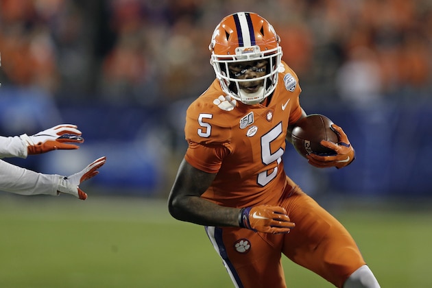 Clemson wide receiver Tee Higgins (5) runs against Virginia during the first half of the Atlantic Coast Conference championship NCAA college football game in Charlotte, N.C., Saturday, Dec. 7, 2019. (AP Photo/Gerry Broome)