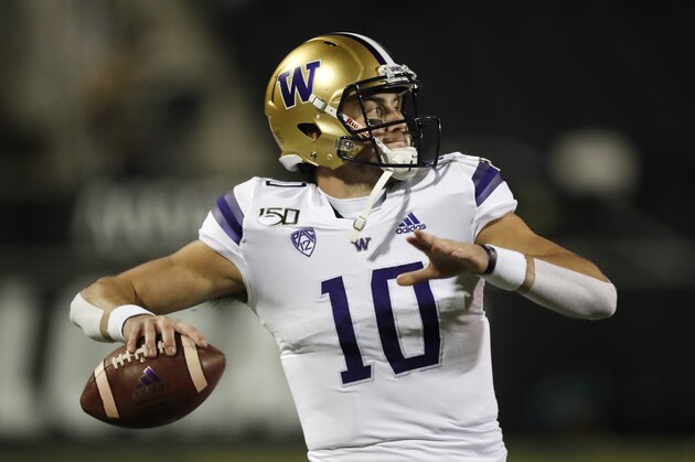 Washington quarterback Jacob Eason (10) warms up before the first half of an NCAA college football game Saturday, Nov. 23, 2019, in Boulder, Colo. (AP Photo/David Zalubowski)