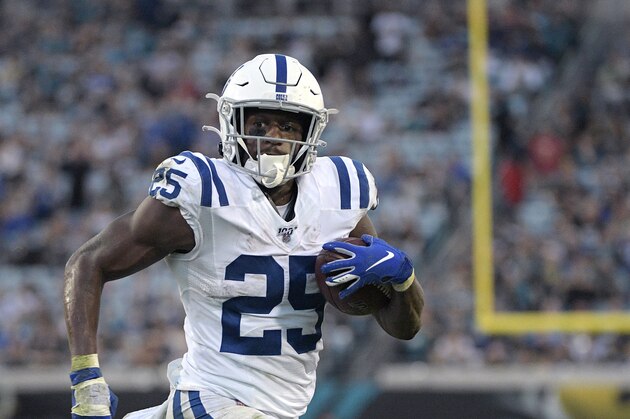 Indianapolis Colts running back Marlon Mack (25) rushes for an 8-yard touchdown during the first half of an NFL football game against the Jacksonville Jaguars Sunday, Dec. 29, 2019, in Jacksonville, Fla. (AP Photo/Phelan M. Ebenhack)