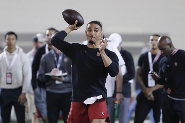Oklahoma quarterback Jalen Hurts runs through drills during Pro Day in Norman, Okla., Wednesday, March 11, 2020. (AP Photo/Alonzo Adams)