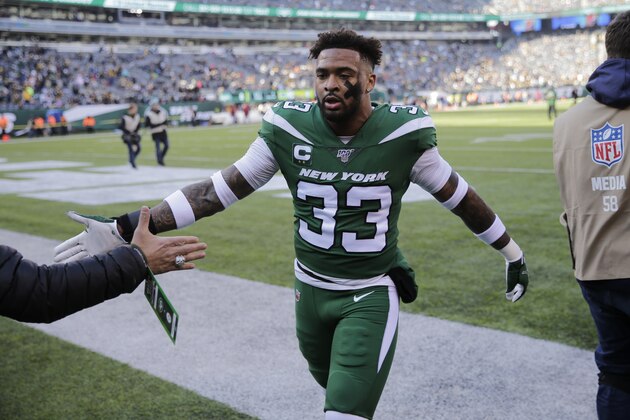 New York Jets strong safety Jamal Adams (33) greets a fan before an NFL football game against the Pittsburgh Steelers, Sunday, Dec. 22, 2019, in East Rutherford, N.J. (AP Photo/Seth Wenig)