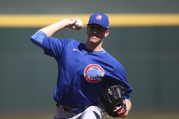 Chicago Cubs starting pitcher Kyle Hendricks warms up during the second inning of a spring training baseball game against the Cleveland Indians Saturday, March 7, 2020, in Goodyear, Ariz. The Cubs defeated the Indians 8-5. (AP Photo/Ross D. Franklin)