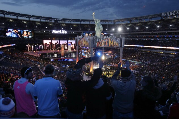 Fans watch the WWE Wrestlemania 29 wrestling event, Sunday, April 7, 2013, in East Rutherford, N.J. (AP Photo/Mel Evans)