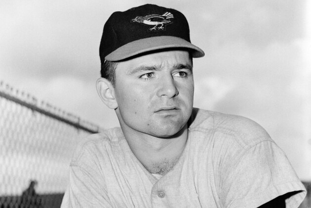 FILE - This is a 1959 file photo showing Baltimore Orioles minor league pitcher Steve Dalkowski posed in Miami, Fla. Dalkowski, a hard-throwing, wild left-hander who inspired the creation of the character Nuke LaLoosh in the movie