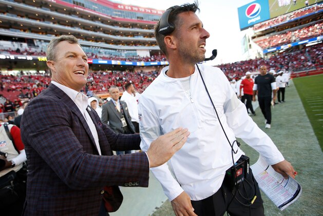 SANTA CLARA, CA - OCTOBER 27: General Manager John Lynch of the San Francisco 49ers celebrates with Head Coach Kyle Shanahan on the sideline in the final minutes of the game against the Carolina Panthers at Levi's Stadium on October 27, 2019 in Santa Clara, California. The 49ers defeated the Panthers 51-13. (Photo by Michael Zagaris/San Francisco 49ers/Getty Images)