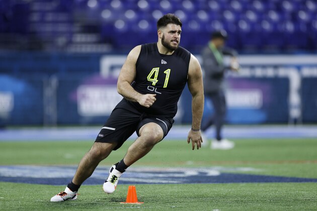INDIANAPOLIS, IN - FEBRUARY 28: Offensive lineman Jon Runyan Jr. of Michigan runs a drill during the NFL Combine at Lucas Oil Stadium on February 28, 2020 in Indianapolis, Indiana. (Photo by Joe Robbins/Getty Images)
