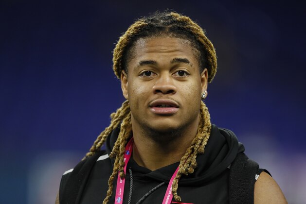 FILE - In this Feb. 20, 2020, file photo, Ohio State defensive lineman Chase Young watches a drill at the NFL football scouting combine in Indianapolis. Young is a likely first round pick in the NFL Draft Thursday, April 23, 2020. (AP Photo/Charlie Neibergall, File)