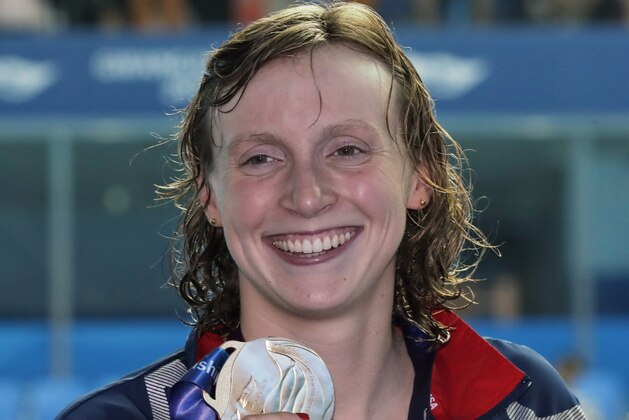 Gold medalist United States' Katie Ledecky poses with her medal following the women's 800m freestyle final at the World Swimming Championships in Gwangju, South Korea, Saturday, July 27, 2019. (AP Photo/Lee Jin-man)
