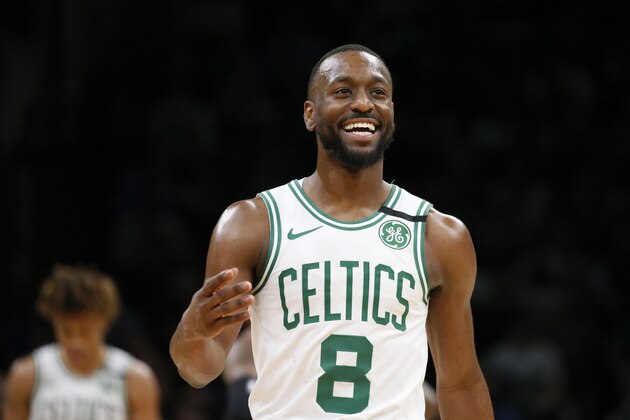 Boston Celtics guard Kemba Walker (8) smiles late in the second half of an NBA basketball game against the Atlanta Hawks, Friday, Feb. 7, 2020, in Boston. (AP Photo/Mary Schwalm)