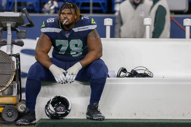 SEATTLE, WA - DECEMBER 29:  Offensive tackle D.J. Fluker #78 of the Seattle Seahawks sits on the bench after losing to the San Francisco 49ers 26-21 at CenturyLink Field on December 29, 2019 in Seattle, Washington.  (Photo by Otto Greule Jr/Getty Images)