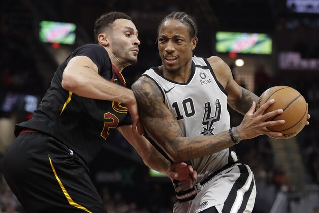 San Antonio Spurs' DeMar DeRozan (10) drives past Cleveland Cavaliers' Larry Nance Jr. (22) in the second half of an NBA basketball game, Sunday, March 8, 2020, in Cleveland. (AP Photo/Tony Dejak)