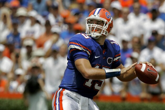 ** FILE ** In this Aug. 30, 2008 file photo, Florida quarterback Tim Tebow looks for a receiver during the first half of a football game against Hawaii in Gainesville, Fla. Tebow didn't have the same gaudy numbers this season as he did last year, but he might have been even more valuable to the top-ranked Gators. If voters see it the same way, Tebow would become the second player to win the Heisman Trophy in consecutive years. (AP Photo/John Raoux, File)