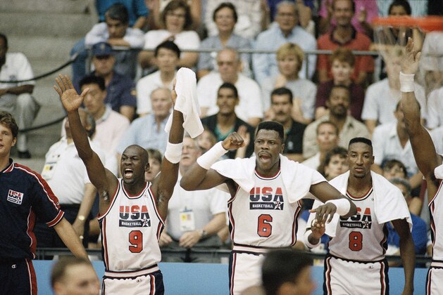 USA's Michael Jordan (9), Patrick Ewing (6) and Scottie Pippen (8) cheer on teammates during gold medal basketball game against Croatia in Barcelona Saturday. (AP Photo/John Gaps) USA's Michael Jordan (9), Patrick Ewing (6) and Scottie Pippen (8) cheer on teammates during gold medal basketball game against Croatia in Barcelona Saturday. (AP Photo/John Gaps)