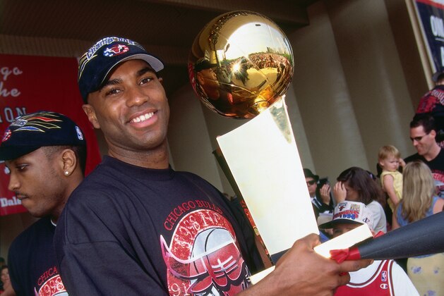 CHICAGO, IL - JUNE 16: Scott Burrell #24 of the Chicago Bulls with the Larry O'Brien NBA Championship Trophy during the 1998 Chicago Bulls Celebration Rally on June 16, 1998 at Grant Park in Chicago, Illinois. NOTE TO USER: User expressly acknowledges and agrees that, by downloading and/or using this photograph, user is consenting to the terms and conditions of the Getty Images License Agreement. Mandatory Copyright Notice: Copyright 1998 NBAE (Photo by Andrew D. Bernstein/NBAE via Getty Images)