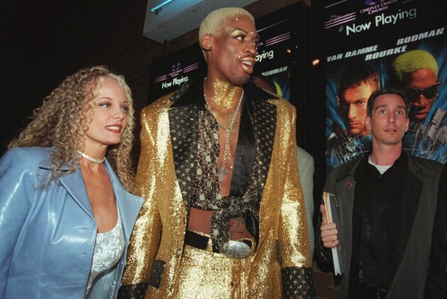 Chicago Bulls' Dennis Rodman, accompanied by Stacy Yarbough, left, arrives for the world premier of his first movie Chicago Bulls' Dennis Rodman, accompanied by Stacy Yarbough, left, arrives for the world premier of his first movie