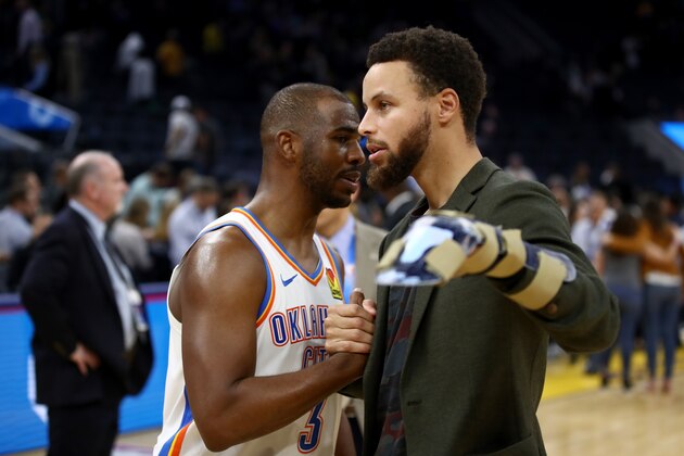 SAN FRANCISCO, CALIFORNIA - NOVEMBER 25:  Injured Stephen Curry #30 of the Golden State Warriors talks to Chris Paul #3 of the Oklahoma City Thunder after their game at Chase Center on November 25, 2019 in San Francisco, California.  NOTE TO USER: User expressly acknowledges and agrees that, by downloading and or using this photograph, User is consenting to the terms and conditions of the Getty Images License Agreement. (Photo by Ezra Shaw/Getty Images)