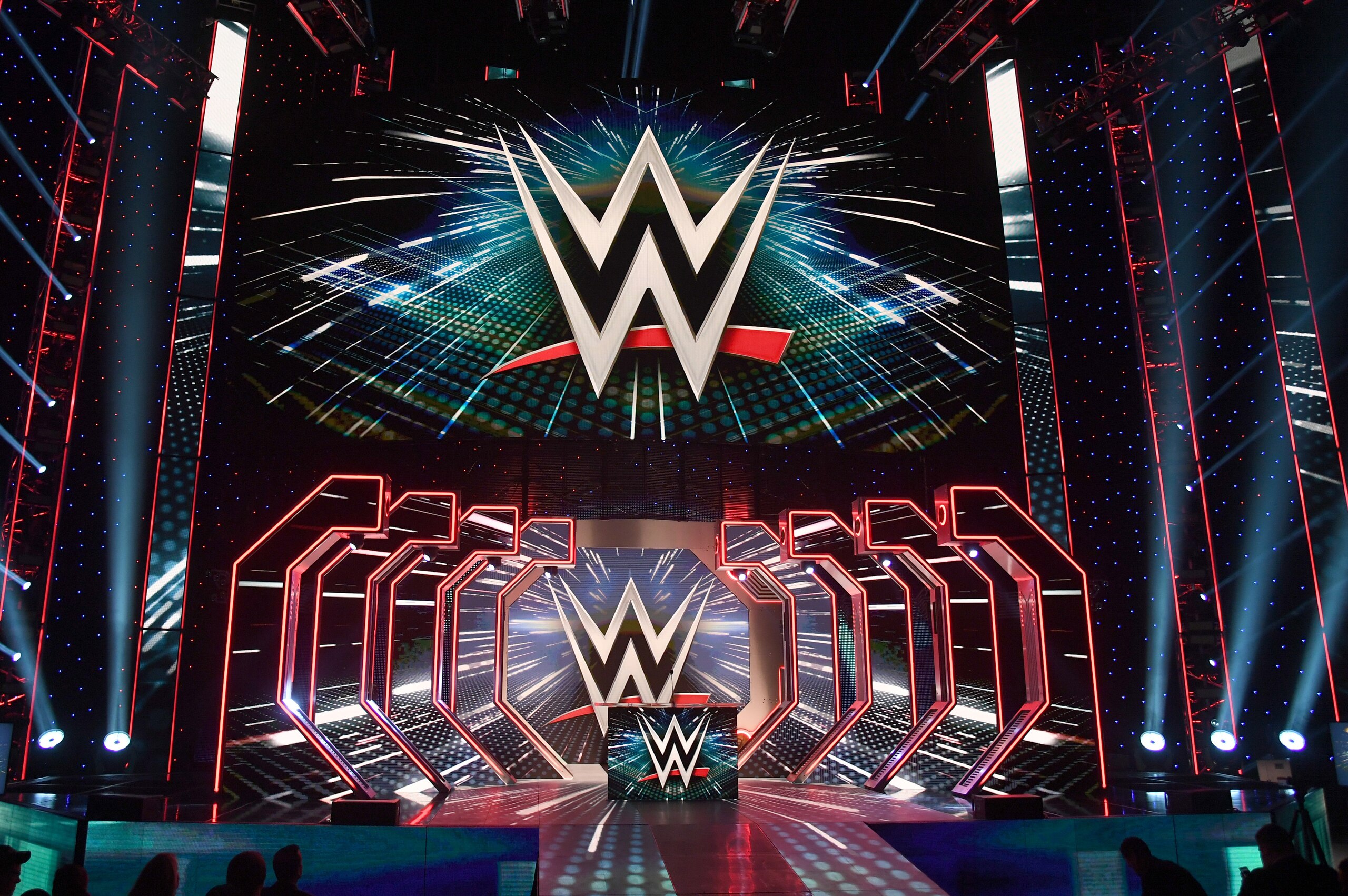 LAS VEGAS, NEVADA - OCTOBER 11:  WWE logos are shown on screens before a WWE news conference at T-Mobile Arena on October 11, 2019 in Las Vegas, Nevada. It was announced that WWE wrestler Braun Strowman will face heavyweight boxer Tyson Fury and WWE champion Brock Lesnar will take on former UFC heavyweight champion Cain Velasquez at the WWE's Crown Jewel event at Fahd International Stadium in Riyadh, Saudi Arabia on October 31.  (Photo by Ethan Miller/Getty Images)