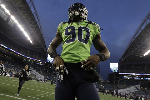 Seattle Seahawks defensive end Jadeveon Clowney stands on the field before an NFL football game against the Minnesota Vikings, Monday, Dec. 2, 2019, in Seattle. (AP Photo/Ted S. Warren)