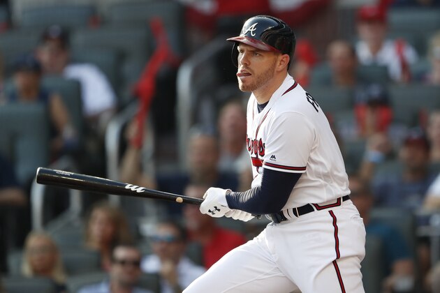 Atlanta Braves first baseman Freddie Freeman (5) hits a single against the St. Louis Cardinals in the first inning during Game 1 of a best-of-five National League Division Series, Thursday, Oct. 3, 2019, in Atlanta. (AP Photo/John Bazemore)