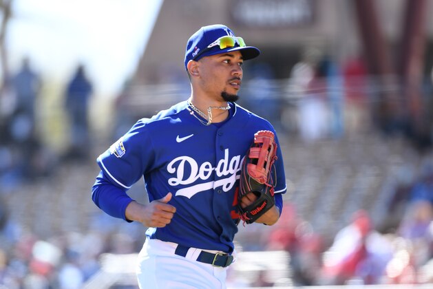 GLENDALE, ARIZONA - FEBRUARY 26: Mookie Betts #50 of the Los Angeles Dodgers runs back to the dugout from right field during a spring training game against the Los Angeles Angels at Camelback Ranch on February 26, 2020 in Glendale, Arizona. (Photo by Norm Hall/Getty Images)