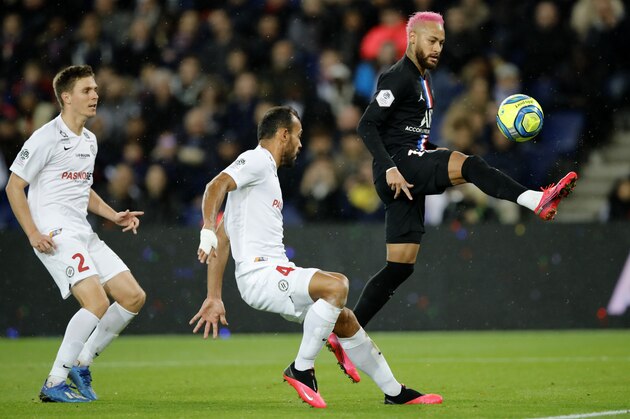 PSG's Neymar, right, controls the ball by Montpellier's Vitorino Hilton, center, and Arnaud Souquet during the French League One soccer match between Paris-Saint-Germain and Montpellier at the Parc des Princes stadium in Paris, Saturday Feb. 1, 2020. (AP Photo/Christophe Ena)